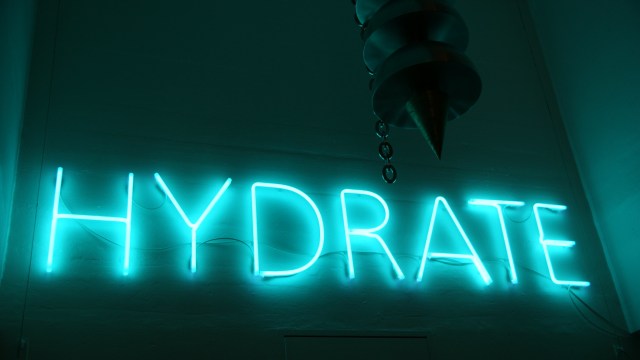 Neon lights saying HYDRATE