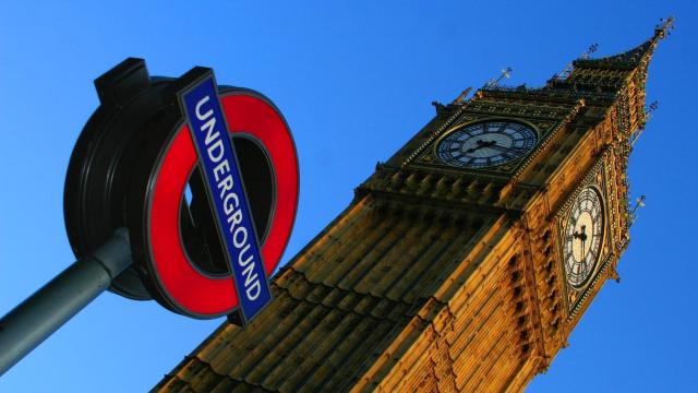 Photo of Big Ben next to a sign that says UNDERGROUND