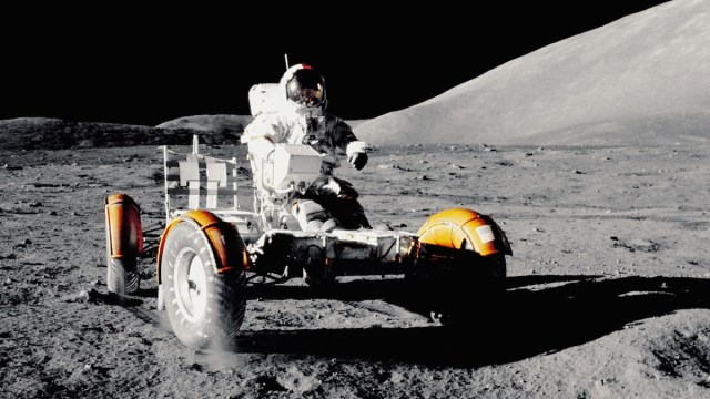 Moon words and phrases represented by an astronaut riding on a lunar buggy.
