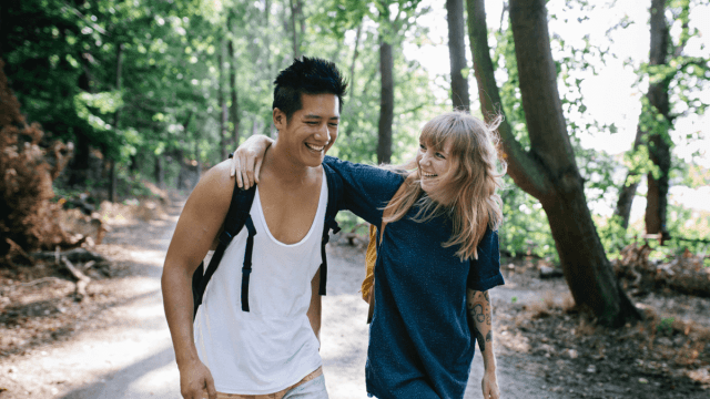two friends on a hiking trail learning a language with friends