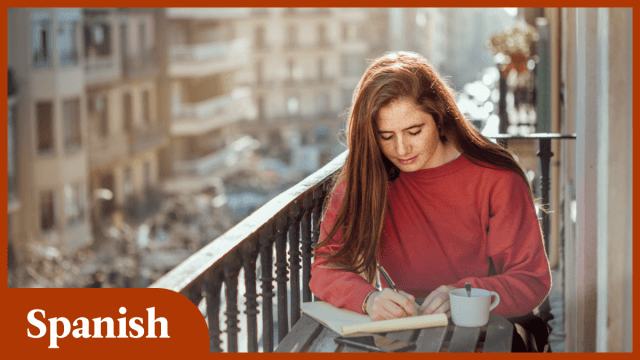 woman sitting on balcony studying Spanish basics