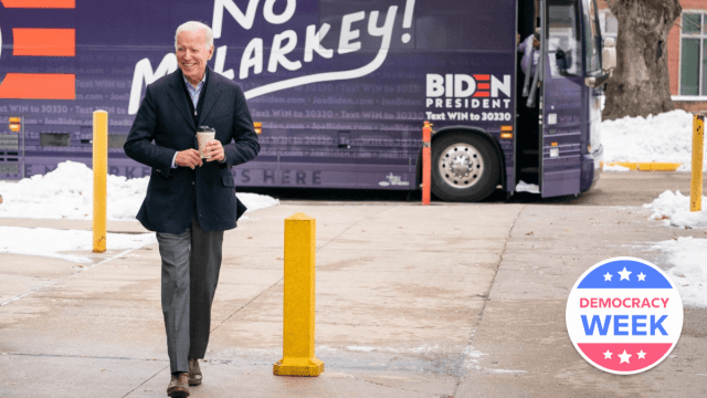 Joe Biden walking in front of campaign bus that says malarkey a political jargon term