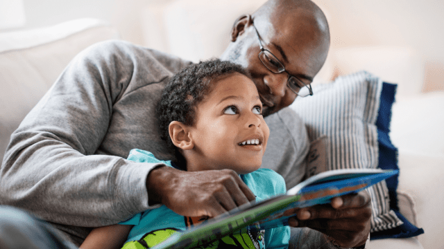father and son reading together and language learning through storytelling
