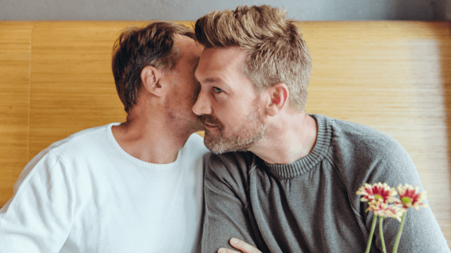 man whispering in his partner's ear what is polari
